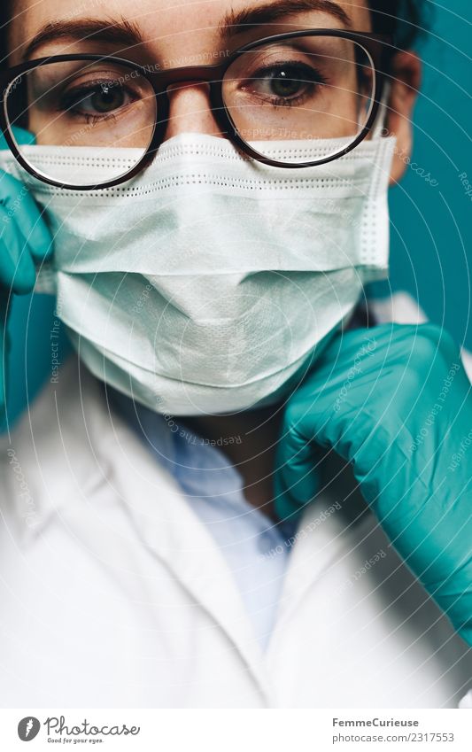 Female doctor with face mask, protective gloves and lab coat Work and employment Profession Doctor Feminine Young woman Youth (Young adults) Woman Adults 1