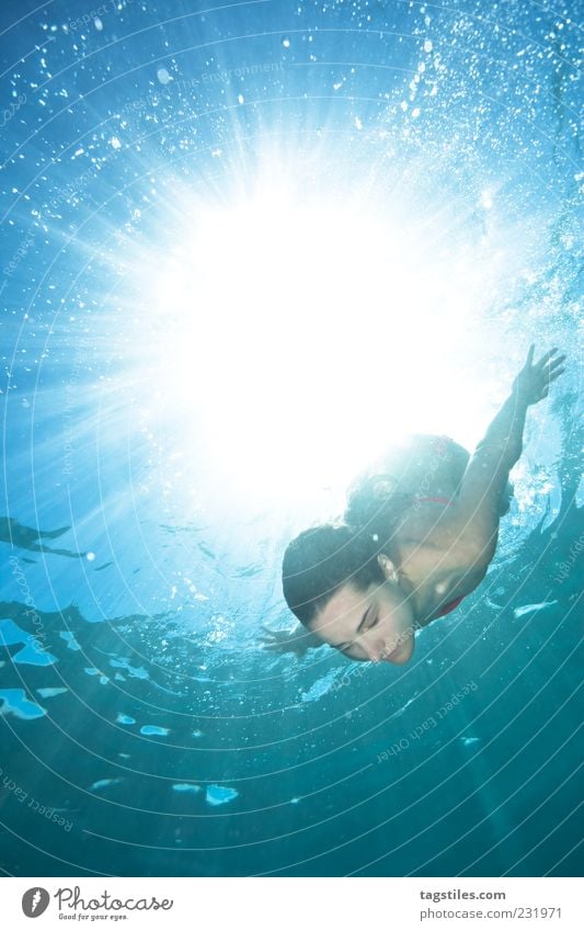 BORN BY THE SUN Mauritius Dive Swimming & Bathing Float in the water Refrigeration Summer Sun Beam of light Woman Life Abstract Water Ocean Surface of water