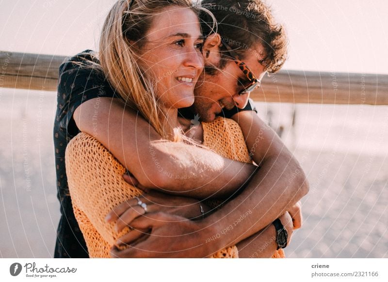 Young adult couple hugging each other Lifestyle Happy Beautiful Summer Beach Woman Adults Man Family & Relations Couple Smiling Love Embrace Happiness Together