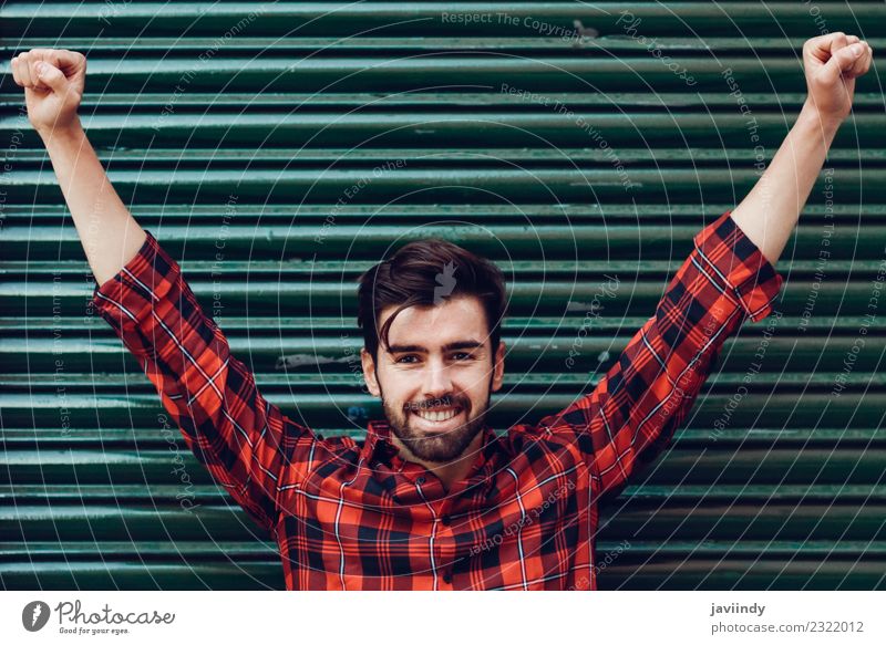 Young smiling man with open arms wearing a plaid shirt Lifestyle Style Beautiful Hair and hairstyles Human being Young man Youth (Young adults) Man Adults
