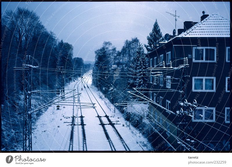 The detail Winter Bad weather Aachen House (Residential Structure) Facade Logistics Railroad tracks Crash Stress Dark Cold Empty Overhead line Calm