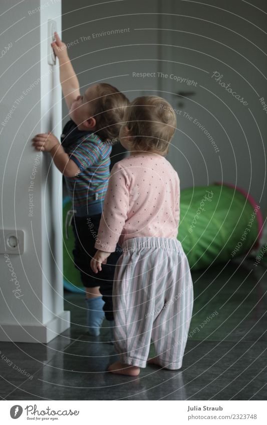 Two small children want to turn on the light Masculine Feminine Toddler girl Boy (child) 2 Human being 1 - 3 years House (Residential Structure) door Socket