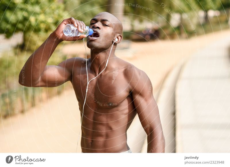 Fit shirtless young black man drinking water after running Drinking Bottle Lifestyle Body Sports Jogging Human being Masculine Young man Youth (Young adults)