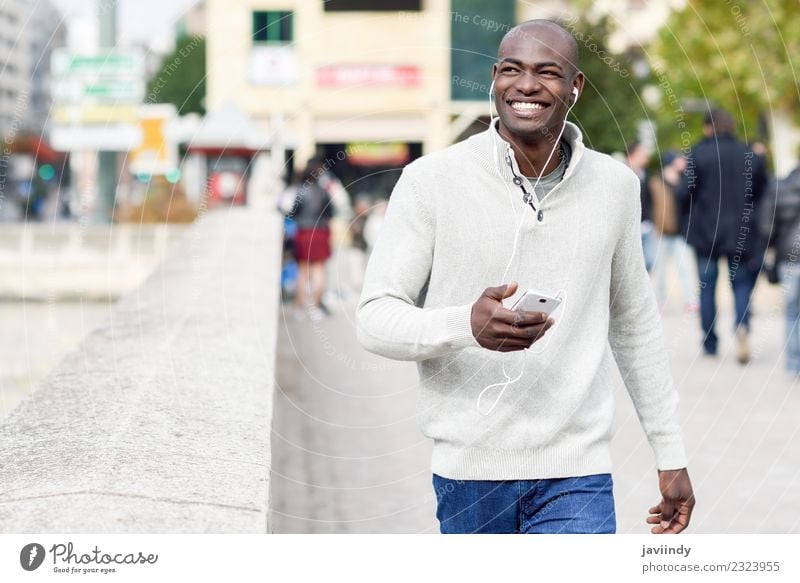 Smiling black man with smartphone in his hand Lifestyle Happy Face Technology Human being Masculine Young man Youth (Young adults) Man Adults 1 18 - 30 years