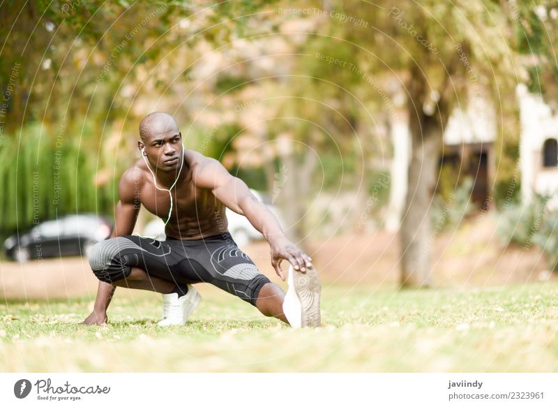 Athletic man doing lunge forward. Sport at home concept. Strong man  stretching legs before workout. Healthcare concept. Male sportsman in black  sports Stock Photo - Alamy
