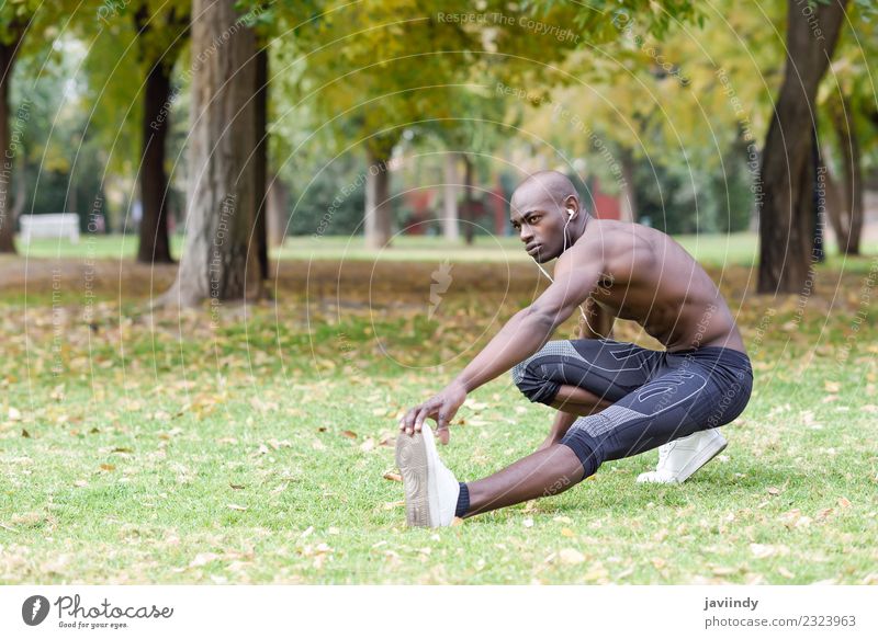 Fit shirtless young black man doing legs stretching Lifestyle Body Sports Human being Masculine Young man Youth (Young adults) Man Adults 1 18 - 30 years