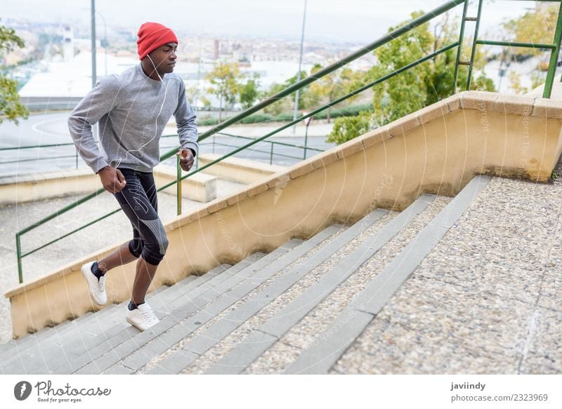 Black man running upstairs outdoors Lifestyle Body Winter Sports Jogging Human being Masculine Young man Youth (Young adults) Man Adults 1 18 - 30 years Fitness