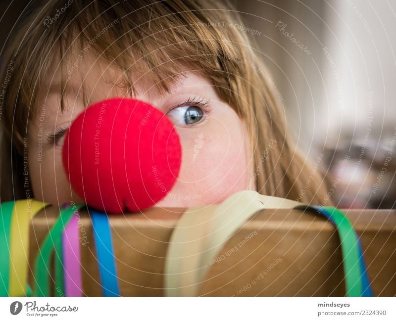 Blonde Girl Peeping Out From Behind A Red Clown Nose A Royalty Free Stock Photo From Photocase