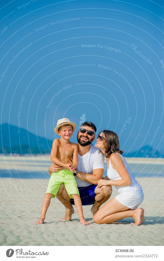 Happy young family of three having fun Lifestyle Joy Playing Summer Ocean Island Infancy Group Sunglasses Beard Smiling Happiness Together 30-34 years 8-9 years