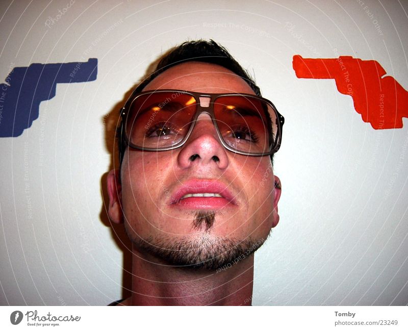 downed projectiles Man Face of a man Facial hair Eyeglasses Handgun Cool (slang)