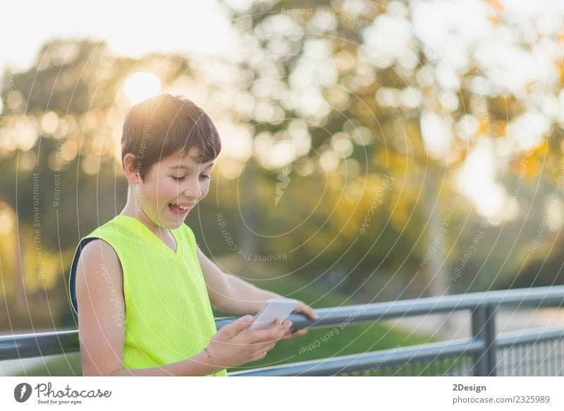 Portrait of a teenager smiling looking his smartphone Lifestyle Style Joy Happy Leisure and hobbies Decoration School Academic studies Telephone PDA Technology