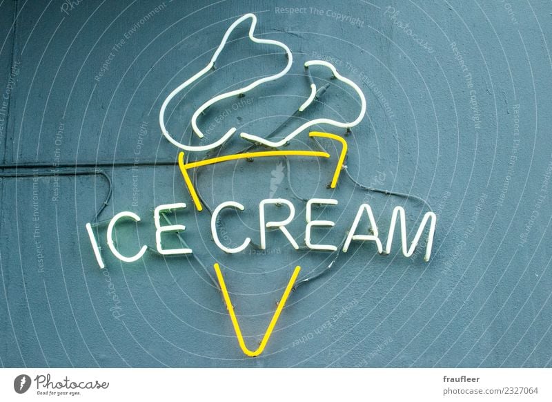 ice cream Ice cream Shopping Vacation & Travel Wall (barrier) Wall (building) Sign Characters Signs and labeling Yellow Gray White Neon sign Neon light