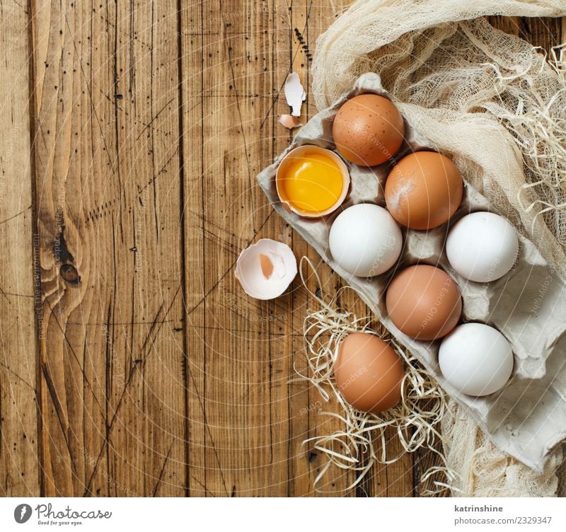 Chicken eggs in a box Breakfast Decoration Feasts & Celebrations Easter Wood Fresh Small Natural Retro Brown Yellow White Tradition background Farm food healthy