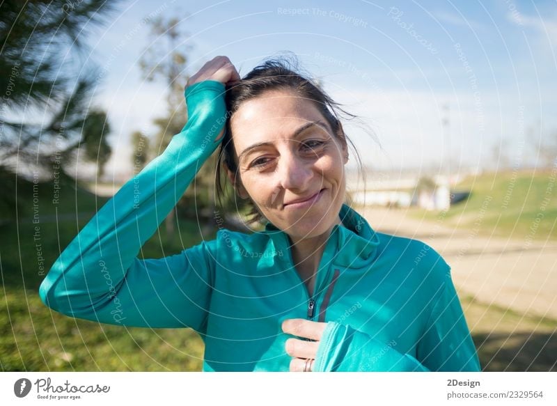 portrait of a runner woman at the park after running Lifestyle Beautiful Summer Sports Jogging Human being Woman Adults Nature Park Fitness Stand Athletic