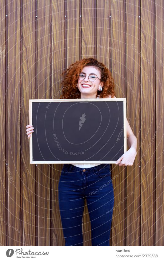Redhead young woman holding an empty blackboard Lifestyle Style Beautiful Hair and hairstyles Education Blackboard Student Teacher Work and employment
