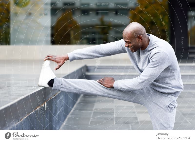 Black man doing stretching after running outdoors Lifestyle Body Sports Jogging Human being Masculine Young man Youth (Young adults) Man Adults 1 18 - 30 years