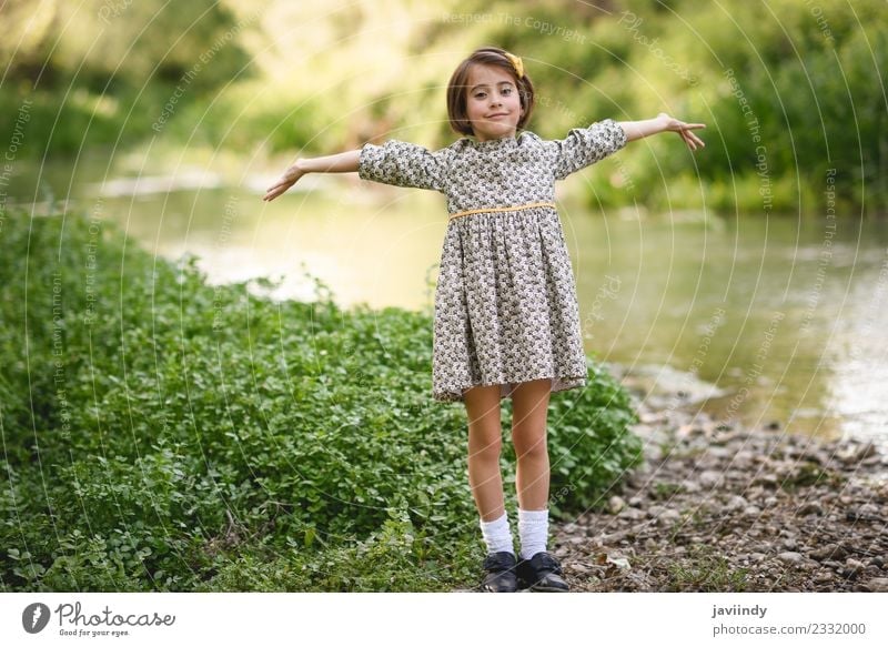 Little beautiful girl in nature stream wearing dress Lifestyle Joy Happy Beautiful Playing Summer Child Human being Feminine Baby Girl Woman Adults Infancy 1