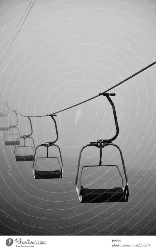 Cable car into nothing Fog Driving Gray Stagnating Central perspective Fog bank Creepy Chair lift Copy Space top Haze Bad weather Black & white photo