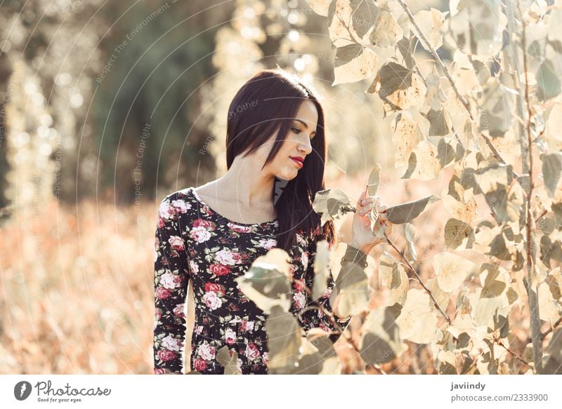 Young woman in Nature looking plants. Lifestyle Happy Beautiful Face Summer Sun Human being Feminine Youth (Young adults) Woman Adults 1 18 - 30 years Autumn