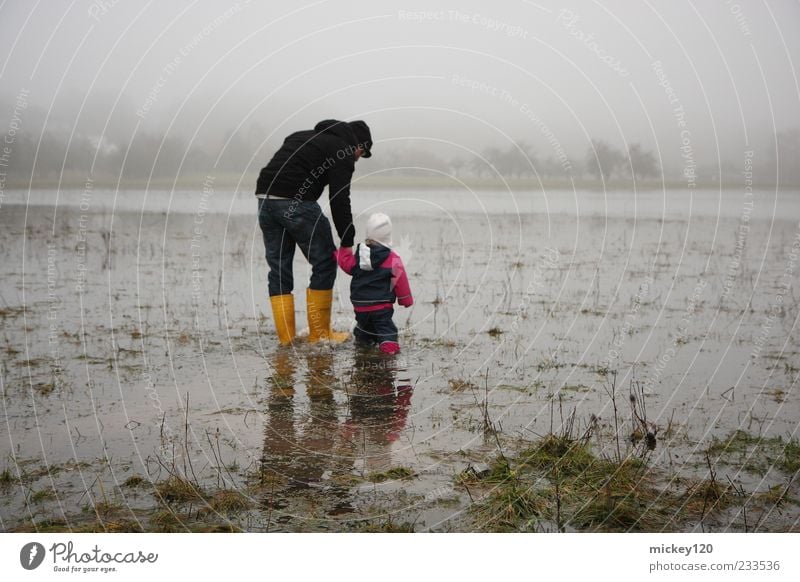 high water Adventure Human being Masculine Child Toddler Girl Man Adults 2 1 - 3 years Nature Landscape Water Climate change Bad weather Fog Grass Meadow Field