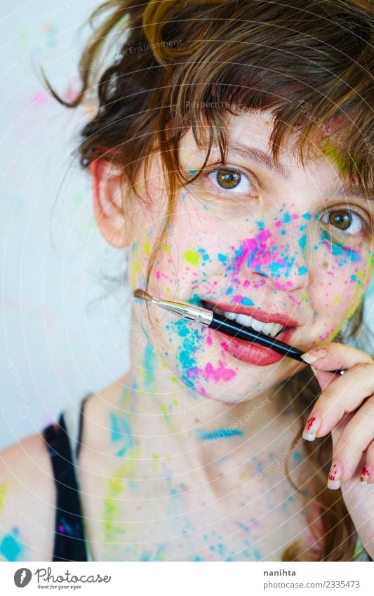 Young woman with paint in her face and a brush Style Exotic Beautiful Skin Face Make-up Harmonious Leisure and hobbies Human being Feminine Youth (Young adults)