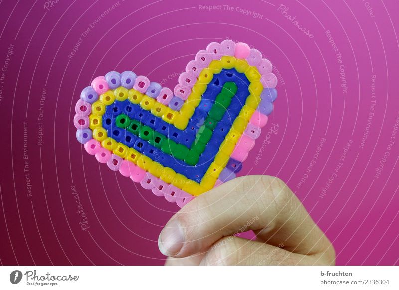 Heart made of beads Fingers Plastic To hold on Pink Friendship Love Infatuation Romance Desire Heart-shaped Handicraft Colour photo Studio shot Artificial light