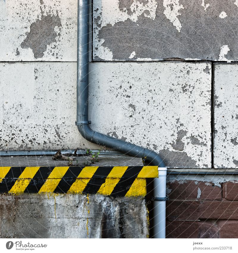 Ramponed Deserted Wall (barrier) Wall (building) Facade Eaves Stone Concrete Wood Metal Plastic Old Dirty Yellow Gray Black White Colour Decline Transience