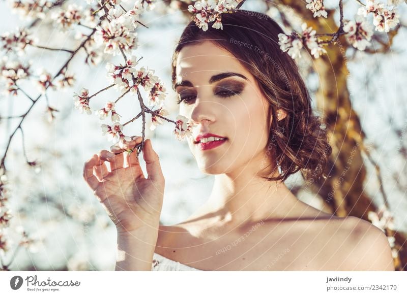 Young woman smelling almond flowers in springtime Style Happy Beautiful Hair and hairstyles Face Wedding Human being Feminine Youth (Young adults) Woman Adults