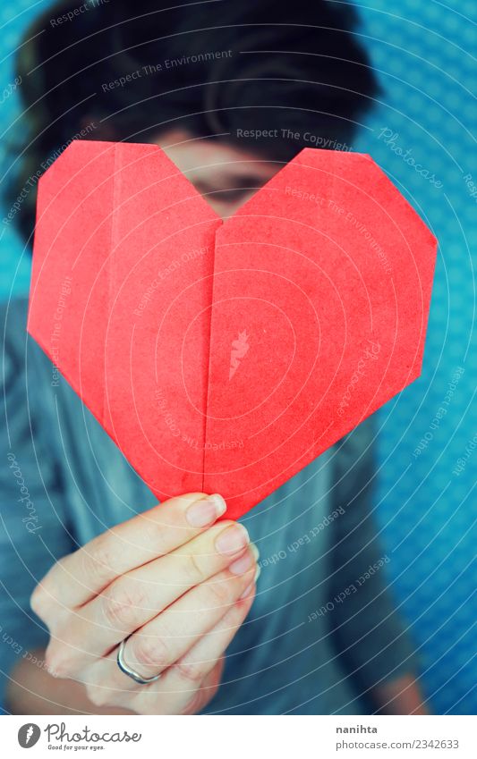 Woman holding a red origami paper heart Healthy Health care Human being Feminine Young woman Youth (Young adults) 1 18 - 30 years Adults Paper Origami