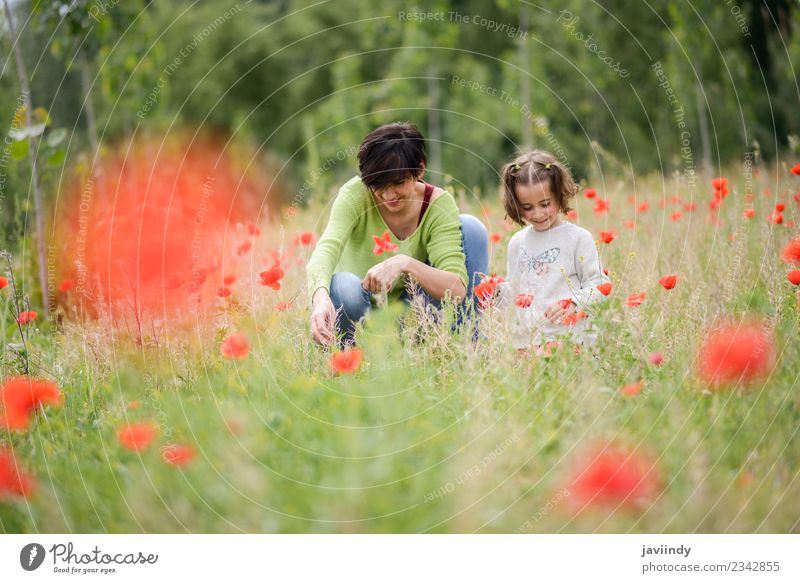 Happy mother with her little daughter in poppy field Lifestyle Child Human being Girl Woman Adults Parents Mother Family & Relations Infancy