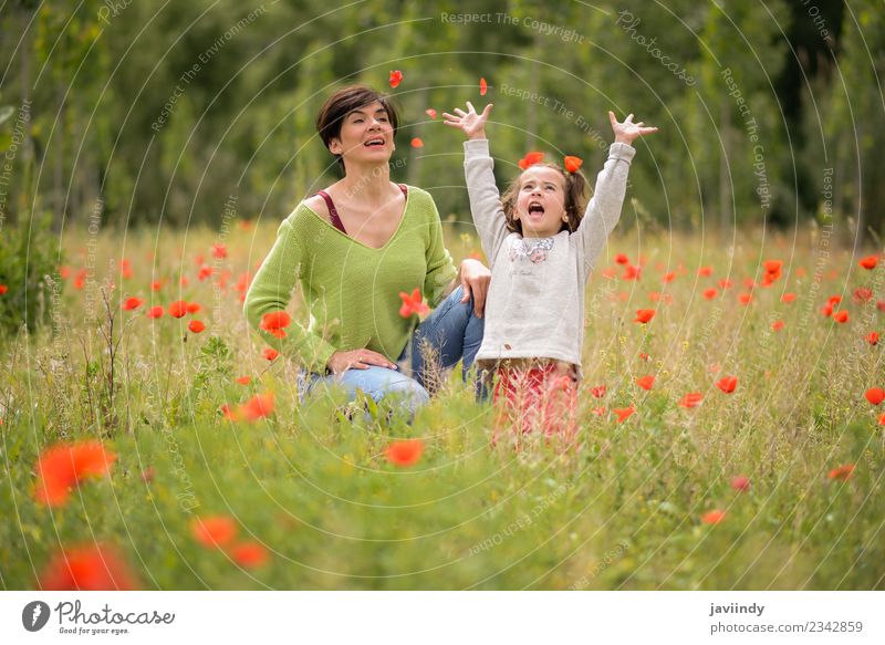 Happy mother with her little daughter in poppy field Lifestyle Joy Child Human being Feminine Girl Woman Adults Mother Family & Relations Infancy 2 3 - 8 years