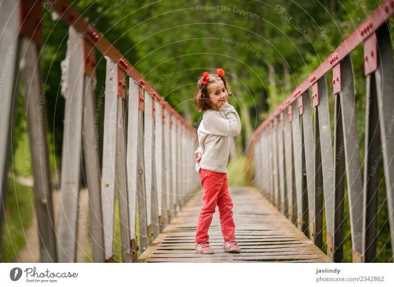 Cute little girl with four years old in a rural bridge Joy Happy Beautiful Life Playing Child Human being Baby Girl Woman Adults Infancy 1 3 - 8 years Nature
