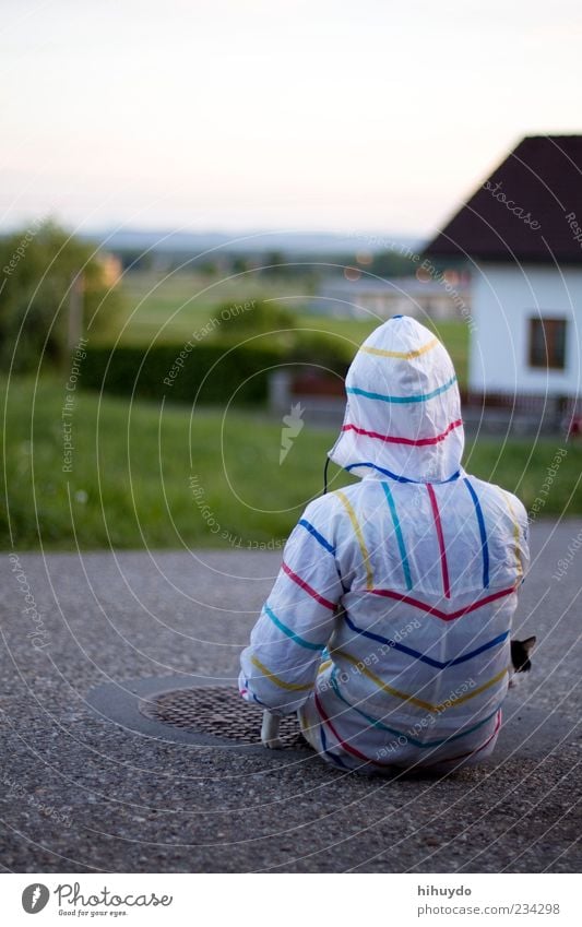 waiting for the rain 2 Masculine Young man Youth (Young adults) 1 Human being Grass Protective clothing Raincoat Animal Pet Cat Observe Wait Colour photo