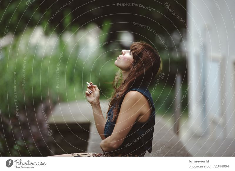 Woman sitting in the backyard smoking. Feminine Young woman Youth (Young adults) Adults 1 Human being 30 - 45 years Breathe Relaxation Smoking Looking Summer