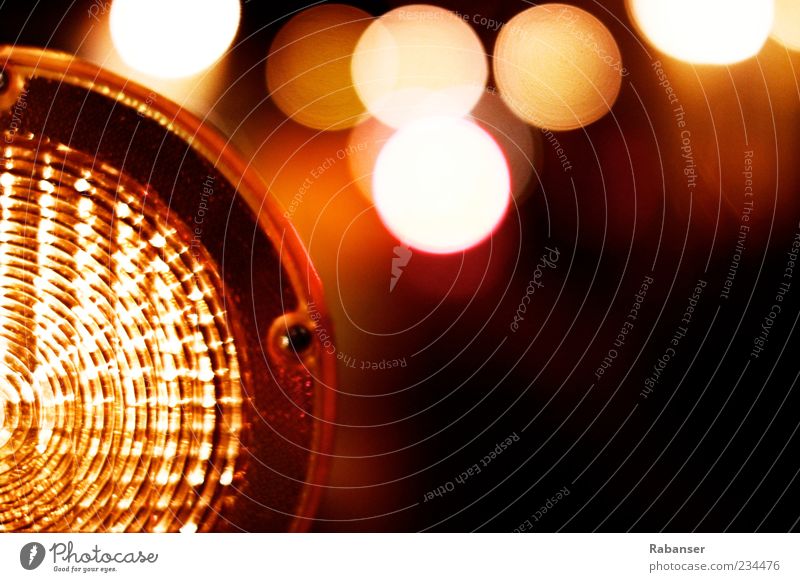 Danger Warn Authentic Yellow Red Black Light Lamp Construction site Blur Detail Round Illuminate Colour photo Exterior shot Deserted Night Shadow Contrast