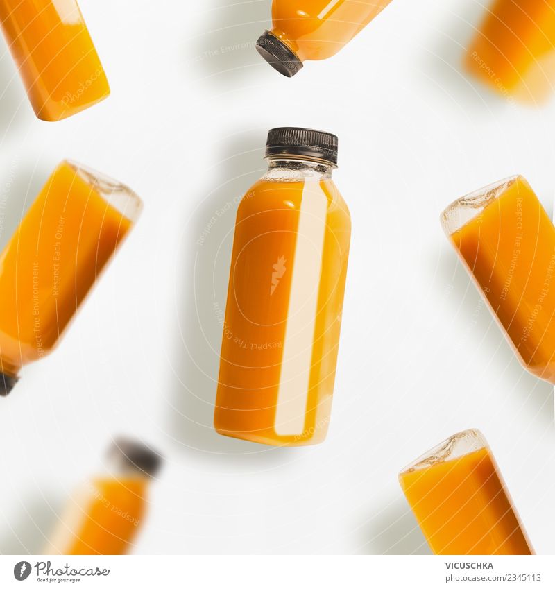 Yellow smoothie or juice bottles on white background Food Organic produce Vegetarian diet Diet Beverage Cold drink Bottle Style Design Healthy Eating