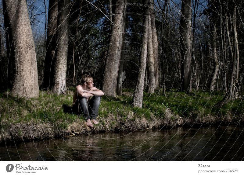 In thought Masculine Young man Youth (Young adults) 1 Human being 18 - 30 years Adults Environment Nature Water Tree Grass Forest River bank Jeans Blonde Think