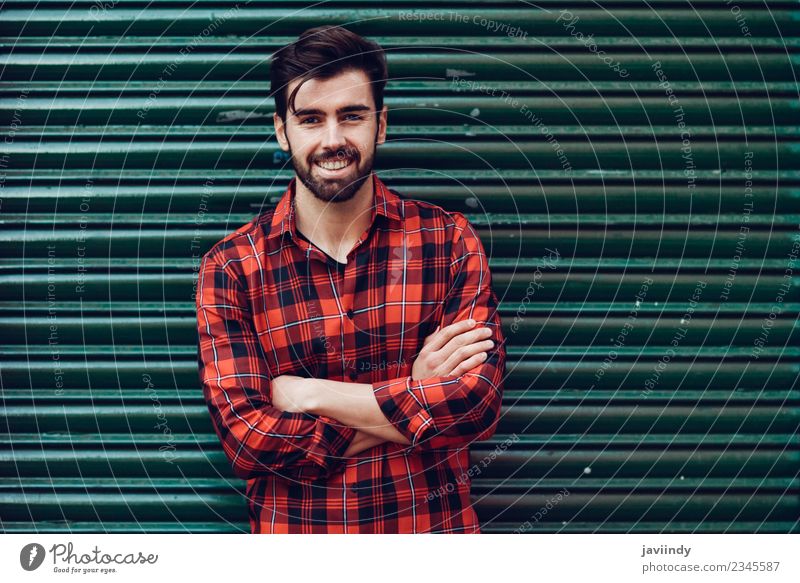 Young smiling man, model of fashion, wearing a plaid shirt with a green blind behind him Lifestyle Style Beautiful Hair and hairstyles Human being Masculine