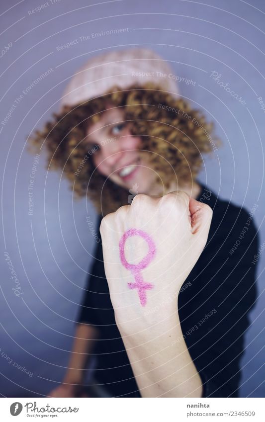 Young woman with a feminine symbol in her hand Human being Feminine Youth (Young adults) 1 18 - 30 years Adults Hat Hair and hairstyles Blonde Long-haired Curl