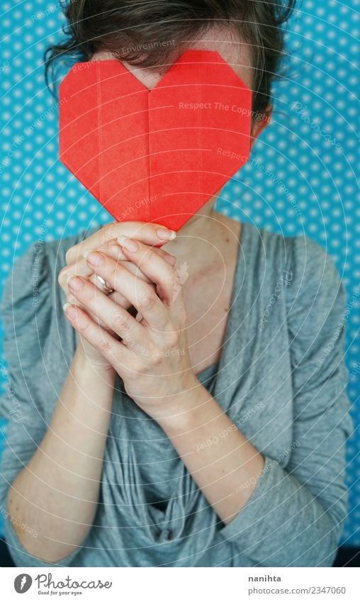 Young woman holding a paper red heart in front of her face Design Feasts & Celebrations Valentine's Day Mother's Day Human being Feminine Youth (Young adults) 1