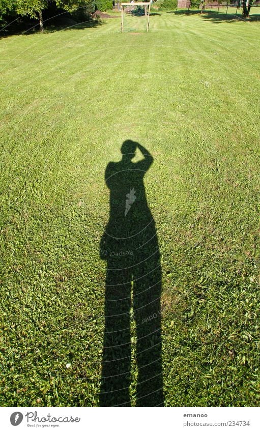 football shadow Summer Football pitch Human being Man Adults 1 Nature Landscape Grass Meadow Stand Large Green Take a photo Photographer Lawn Posture