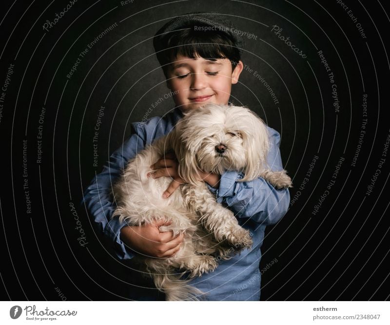 boy hugging his dog Lifestyle Joy Human being Masculine Child Boy (child) Infancy 1 3 - 8 years Accessory Cap Animal Pet Dog To hold on Smiling Laughter