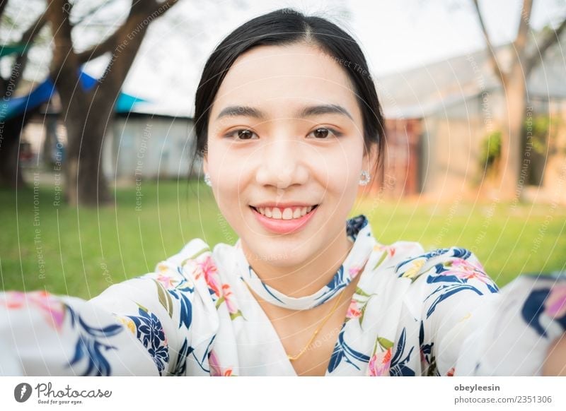beautiful young asian girl have a happy time alone Beverage Lifestyle Joy Happy Beautiful Face Calm Summer Business Woman Adults Park Street Smiling Natural New