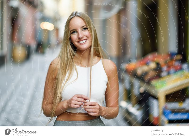 Smiling young woman in urban background. Lifestyle Elegant Style Happy Beautiful Hair and hairstyles Summer Human being Feminine Young woman