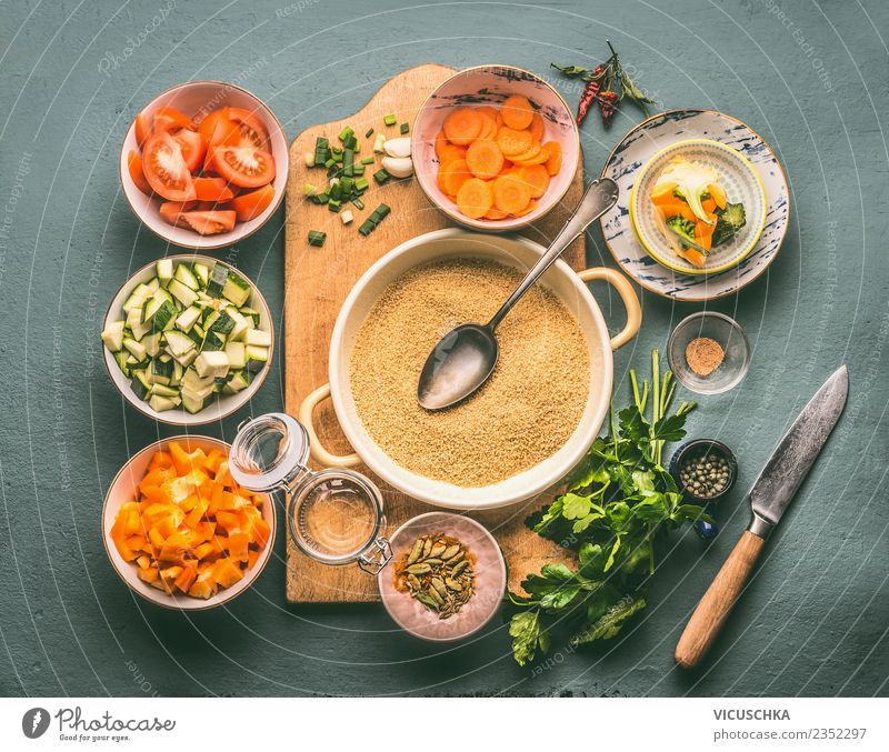 Vegetarian diet with couscous and vegetables Food Vegetable Grain Herbs and spices Nutrition Lunch Dinner Organic produce Diet Crockery Plate Knives Spoon Style