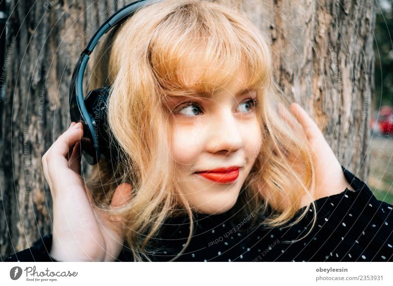 Young pretty girl having fun listening to music in headphones, Lifestyle Style Joy Happy Beautiful Relaxation Leisure and hobbies Summer Music Telephone
