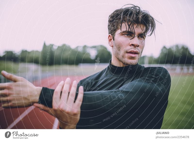 Young sports man is doing stretching at running track Drinking water Lifestyle Joy Body Healthy Healthy Eating Health care Athletic Muscular Fitness Well-being