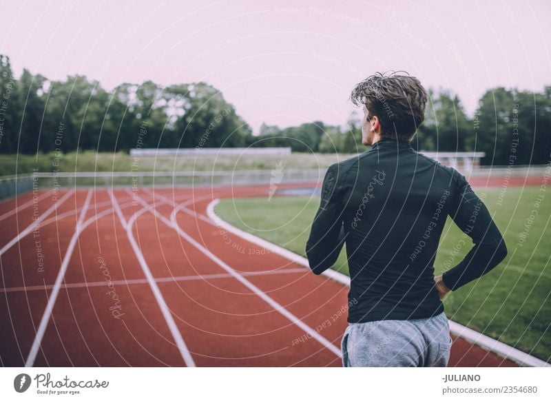 Young sports man exercising at running track Drinking water Lifestyle Joy Body Healthy Healthy Eating Health care Athletic Muscular Fitness Well-being