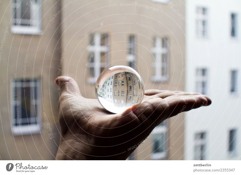 Glass ball + facade Hand Fingers To hold on Indicate Sphere Reflection Rent Tenant Old building Facade Window House (Residential Structure) Apartment house