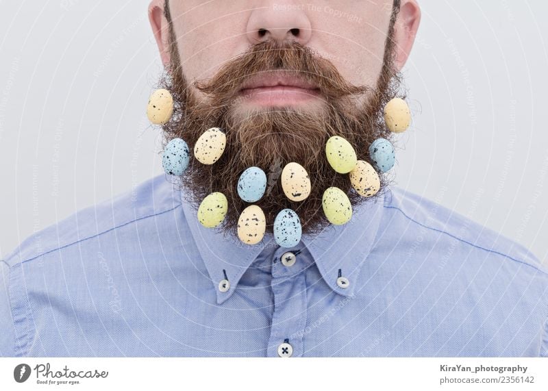 Close up of handsome bearded man with Easter eggs Lifestyle Style Happy Face Decoration Feasts & Celebrations Office Human being Man Adults Fashion Shirt